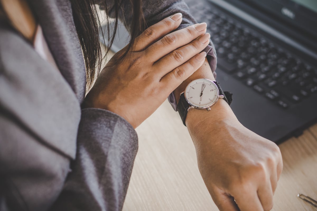 Woman Looking at Wristwatch 